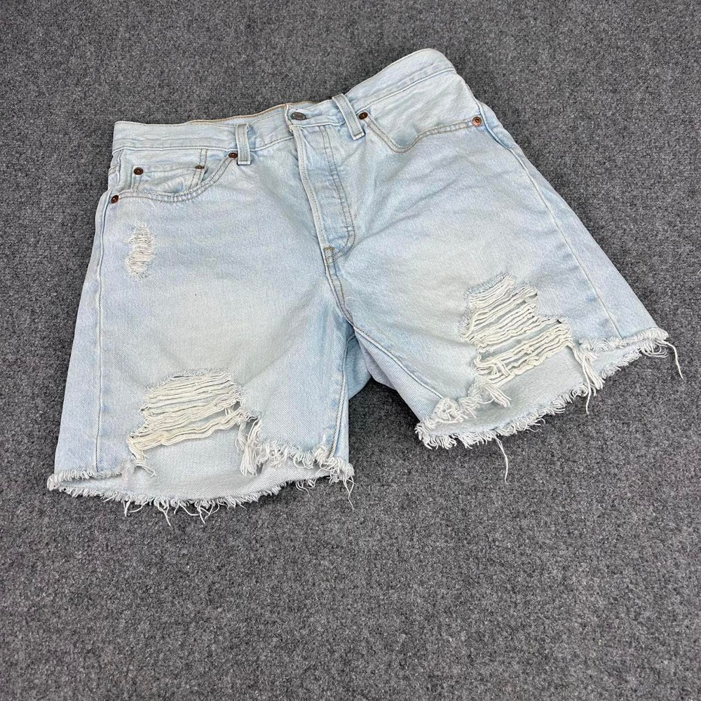 Levi's light wash distressed shorts with frayed hem size 28